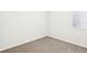 Bright bedroom features neutral carpet, white walls, and window for natural light at 2511 Linda Knoll Ln, Bartow, FL 33830