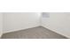 Bright bedroom features neutral carpet, white walls, and window for natural light at 2511 Linda Knoll Ln, Bartow, FL 33830