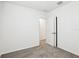 Cozy bedroom features plush carpet, white walls, and doorway to adjoining space at 2511 Linda Knoll Ln, Bartow, FL 33830
