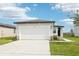 Charming home features a two-car garage, well-manicured lawn, and modern design at 2511 Linda Knoll Ln, Bartow, FL 33830