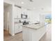 Open kitchen features stainless appliances, granite counters, island, and bright, airy feel at 2511 Linda Knoll Ln, Bartow, FL 33830