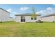 A spacious backyard with lush green grass and minimal landscaping at 2511 Linda Knoll Ln, Bartow, FL 33830