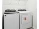 Functional laundry room with modern washer and dryer units, providing convenience for laundry needs at 2511 Linda Knoll Ln, Bartow, FL 33830