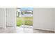 Bright living room with tile flooring and sliding glass doors that provide access to the backyard at 2511 Linda Knoll Ln, Bartow, FL 33830