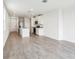 Spacious living room features tile flooring, open floor plan, and modern kitchen at 2511 Linda Knoll Ln, Bartow, FL 33830