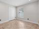 Neutral bedroom features neutral paint, tile flooring, a double door closet and a window at 2524 Monaco Cove Cir, Orlando, FL 32825