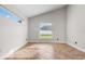 Bright bedroom features tile flooring, neutral walls, and natural light from two windows at 2524 Monaco Cove Cir, Orlando, FL 32825
