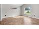 Bright bedroom features tile flooring, neutral walls, and natural light from two windows at 2524 Monaco Cove Cir, Orlando, FL 32825
