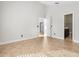Spacious bedroom with tiled floors, multiple doorways, and natural light at 2524 Monaco Cove Cir, Orlando, FL 32825
