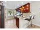 Stylish kitchen with stainless steel appliances, bar seating, and a bright, airy feel at 2524 Monaco Cove Cir, Orlando, FL 32825