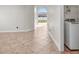 Neutral Laundry room features tile flooring, open doorway and modern washing machine at 2524 Monaco Cove Cir, Orlando, FL 32825