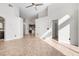 Spacious living room boasts high ceilings, tile flooring, and an open floor plan to the kitchen at 2524 Monaco Cove Cir, Orlando, FL 32825