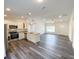 Bright open-concept living space and kitchen offering a modern design and functional layout at 30 Juniper Pass Ln, Ocala, FL 34480