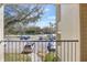 Relaxing view from the balcony overlooking parking and greenery at 3004 Parkway Blvd # 203, Kissimmee, FL 34747