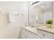 Well-lit bathroom featuring a vanity, mirror, and a shower with white tile at 3004 Parkway Blvd # 203, Kissimmee, FL 34747