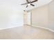 Bedroom featuring tile floors and closet at 3004 Parkway Blvd # 203, Kissimmee, FL 34747