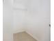 Walk-in closet with shelving and tile floor at 3004 Parkway Blvd # 203, Kissimmee, FL 34747