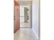 Entrance showcasing the tile floor, open door to balcony and great light from the exterior at 3004 Parkway Blvd # 203, Kissimmee, FL 34747