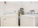 Utility area with washer, dryer, and a water heater for convenience at 3004 Parkway Blvd # 203, Kissimmee, FL 34747