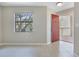 Inviting living room with natural light, tile flooring, and an open entry way to the balcony at 3004 Parkway Blvd # 203, Kissimmee, FL 34747
