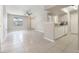 Bright and airy open floor plan with tile flooring, ceiling fan, and an inviting kitchen area at 3004 Parkway Blvd # 203, Kissimmee, FL 34747