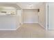 Open living space with tile flooring adjacent to kitchen area and a large closet for storage at 3004 Parkway Blvd # 203, Kissimmee, FL 34747