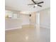 Bright and airy living space with tile flooring and adjacent kitchen at 3004 Parkway Blvd # 203, Kissimmee, FL 34747