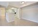 Bright and airy living space featuring tile floors and access to the kitchen and bathroom at 3004 Parkway Blvd # 203, Kissimmee, FL 34747