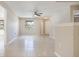 Inviting living space with tile floors, neutral walls, and views to other rooms at 3004 Parkway Blvd # 203, Kissimmee, FL 34747
