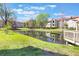 Pond view featuring lush greenery and the peaceful surroundings at 3004 Parkway Blvd # 203, Kissimmee, FL 34747