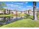 Reflective pond surrounded by well-maintained buildings and landscaping at 3004 Parkway Blvd # 203, Kissimmee, FL 34747