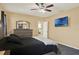 Bright bedroom featuring a ceiling fan, and an ensuite bathroom at 3086 Brenton Manor Loop, Winter Haven, FL 33881