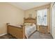 Bedroom with carpet, window, and a bedframe with ornate details at 3086 Brenton Manor Loop, Winter Haven, FL 33881