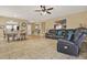 Spacious living area seamlessly connects to dining space, featuring neutral tones and stylish decor at 3086 Brenton Manor Loop, Winter Haven, FL 33881