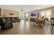 Large open-plan living area with comfortable seating, entertainment center, and dining space at 3086 Brenton Manor Loop, Winter Haven, FL 33881