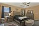 Bright main bedroom with window views, ceiling fan, and furniture set at 3086 Brenton Manor Loop, Winter Haven, FL 33881