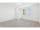 Bright bedroom features neutral carpeting, great natural light, and bright white walls at 3213 Viceroy Ct, Poinciana, FL 34759