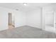 Spacious bedroom features neutral carpet, ample natural light, and an en-suite bathroom at 3213 Viceroy Ct, Poinciana, FL 34759