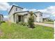 Inviting two-story home with a well-kept lawn, brick driveway, and a welcoming front entrance at 3213 Viceroy Ct, Poinciana, FL 34759