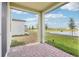 Covered patio overlooking the water, offering a relaxing outdoor space with a brick-paved floor at 3213 Viceroy Ct, Poinciana, FL 34759