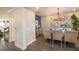 Elegant dining room with stylish chandelier, seating for four, and sophisticated decor at 3222 Viceroy Ct, Kissimmee, FL 34759