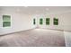 Spacious room with neutral carpeting and many windows providing natural light at 3222 Viceroy Ct, Kissimmee, FL 34759