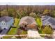 A full aerial view of the property, showcasing the green lawn, landscaping, and proximity to conservation at 3783 Moon Dancer Pl, St Cloud, FL 34772