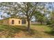Large backyard with green grass, landscaping and privacy fence, perfect for outdoor enjoyment at 3783 Moon Dancer Pl, St Cloud, FL 34772