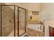 Elegant bathroom featuring a glass shower and a luxurious soaking tub near a window at 3783 Moon Dancer Pl, St Cloud, FL 34772