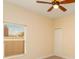 Simple bedroom with a ceiling fan, and a window with views at 3783 Moon Dancer Pl, St Cloud, FL 34772