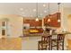 Kitchen featuring stainless steel appliances, granite countertops, breakfast bar and pendant lighting at 3783 Moon Dancer Pl, St Cloud, FL 34772