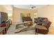 Relaxing living room with plush seating, neutral color palette, and seamless access to the outdoors at 3783 Moon Dancer Pl, St Cloud, FL 34772