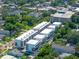 Contemporary townhomes with clean lines, complemented by lush greenery and an urban backdrop at 38 W Harding St # C, Orlando, FL 32806