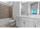 Modern bathroom with a combination bathtub and shower, plus white vanity at 38 W Harding St # C, Orlando, FL 32806